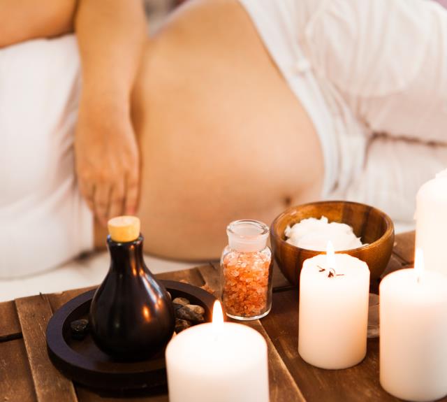 Young pregnant woman relaxing at Spa salon, Spa treatment