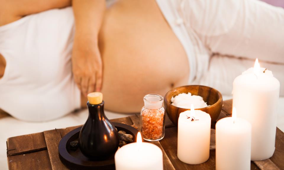 Young pregnant woman relaxing at Spa salon, Spa treatment